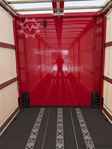 Open semitrailer with tarp  Wiese Gabelstaplertransporter mit Rampe