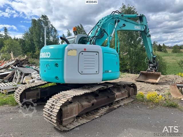 Raupenbagger Kobelco SK235SR Tracked excavator w/ Rototilt and bucket.