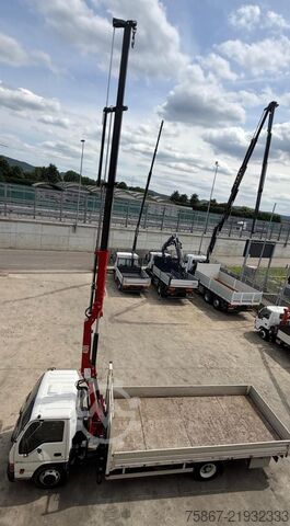 Flatbed truck ISUZU NQR 75