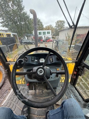 Backhoe loader NEW HOLLAND B 115 c