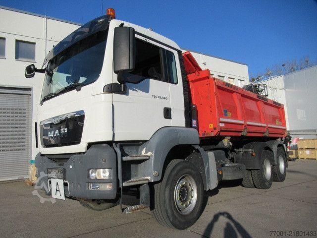 Tipper truck MAN 26.440 / 6 x 4 / Jonsered 1100 / Greifer