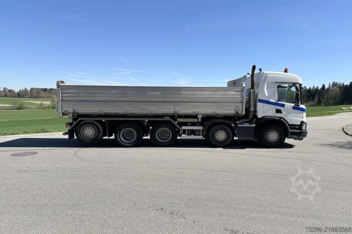 Three-sided tipper truck Scania P 500 10x4 3-SK Trรถsch / Swiss-Vehicle