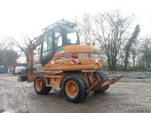 Wheeled Excavator Case WX95 with 4 excavator buckets and forks