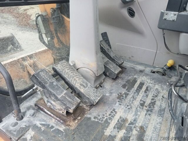 Wheeled Excavator Case WX95 with 4 excavator buckets and forks