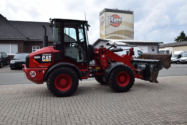 Wheel loader Caterpillar Radlader 908H2 Klappschaufel Gabel SWZSA