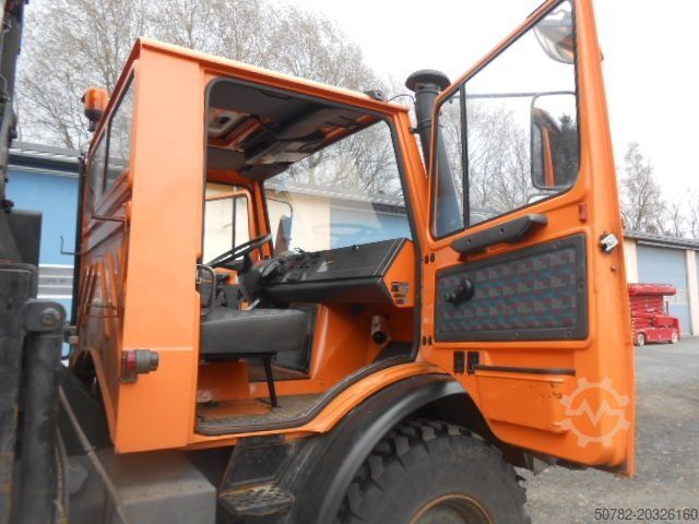 Tipper truck UNIMOG U1450 427/11 mit Kran