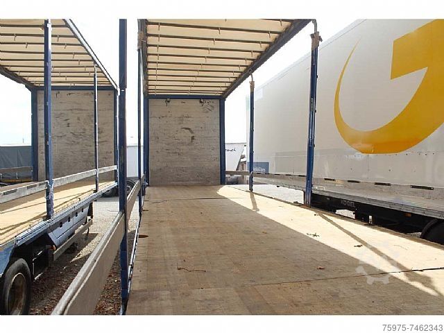 Lowbed construction machinery Meusburger semirimorchio centinato ribassato buche usato