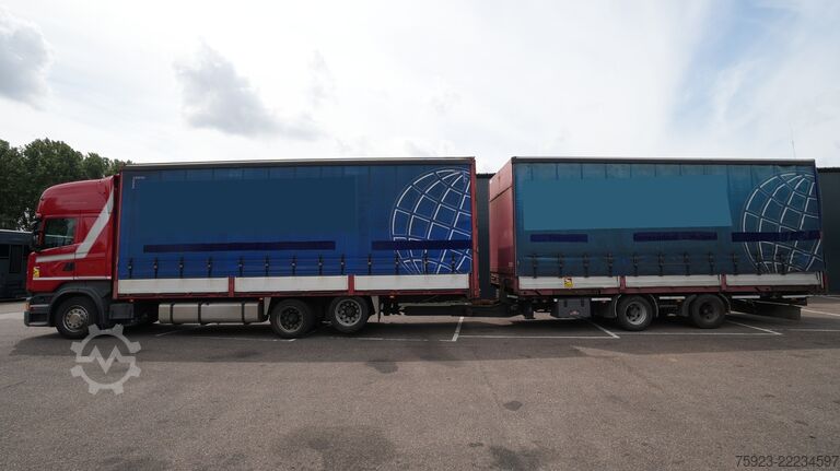 Sliding tarpaulin Scania R 400 6x2 curtainside in combo with Burg trailer