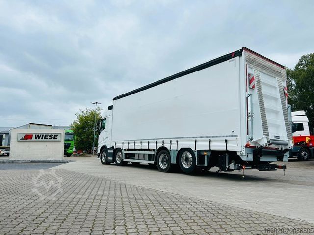 Flatbed truck with tarp VOLVO FH 500 Gabelstaplertransporter LBW Dhollandia 9t
