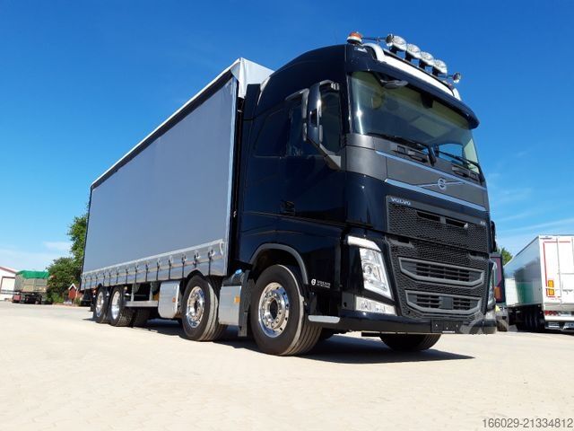 Flatbed truck with tarp VOLVO 8x2 mit Schwerlast-Ladebordwand Rampe Stapler