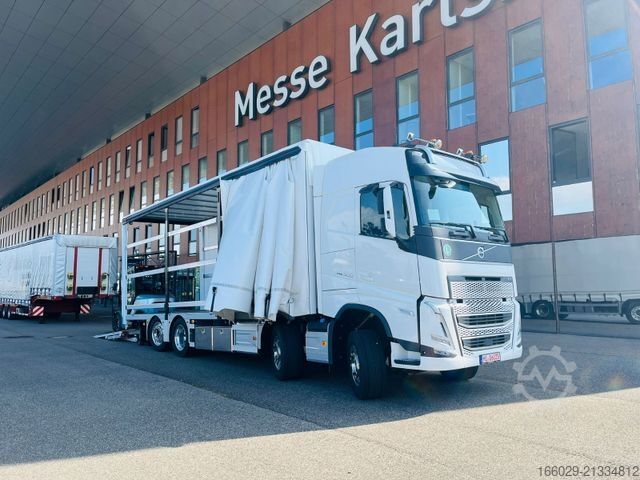Flatbed truck with tarp VOLVO 8x2 mit Schwerlast-Ladebordwand Rampe Stapler