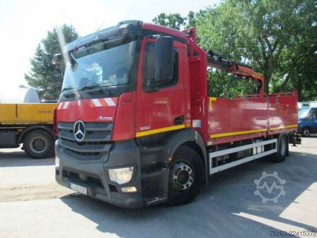 Flatbed truck MERCEDES-BENZ Antos 1830 L Pritsche Heckkran Funk