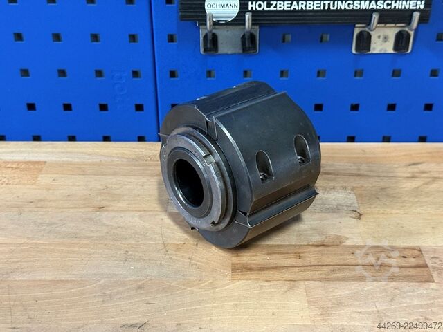 Reversible blade planer head with sleeve  