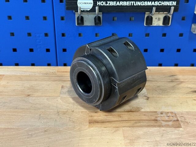 Reversible blade planer head with sleeve  