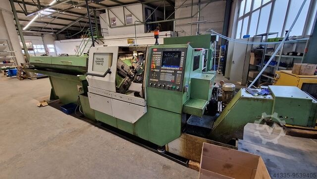 CNC lathe with barfeeder TRAUB TNM 42