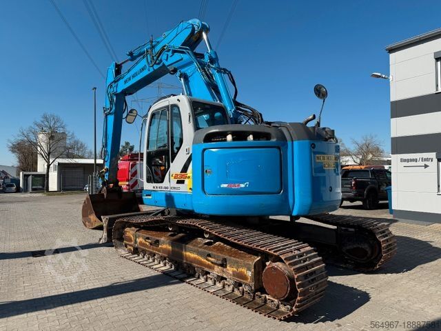 Kettenbagger NEW HOLLAND Kobelco E235 BSR-2 Nullheck Versteller MS21