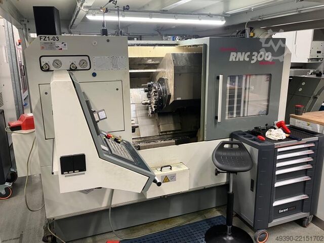 CNC lathe with driven tools and Y-axis; CNC control FANUC Series 18i-TB, machining center. MONFORTS RNC 300 MultiTurn