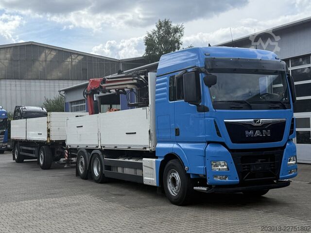 Flatbed truck MAN TGX 26.470 Euro 6 Abrollkipper mit Ladekran