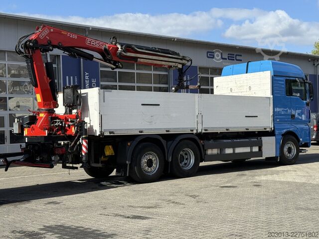 Flatbed truck MAN TGX 26.470 Euro 6 Abrollkipper mit Ladekran