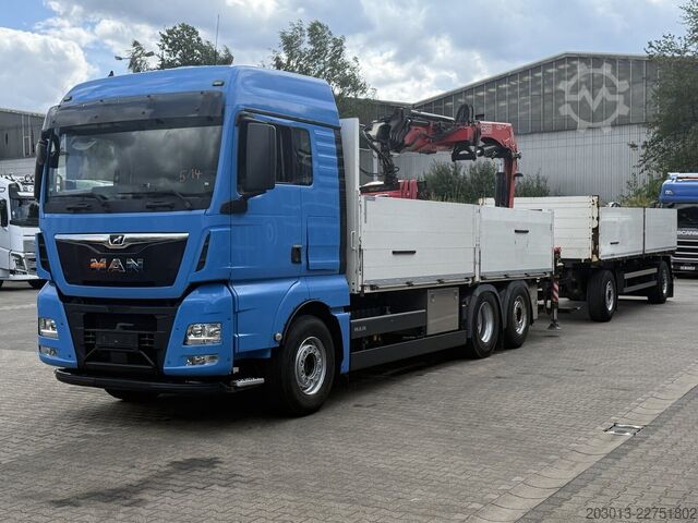 Flatbed truck MAN TGX 26.470 Euro 6 Abrollkipper mit Ladekran